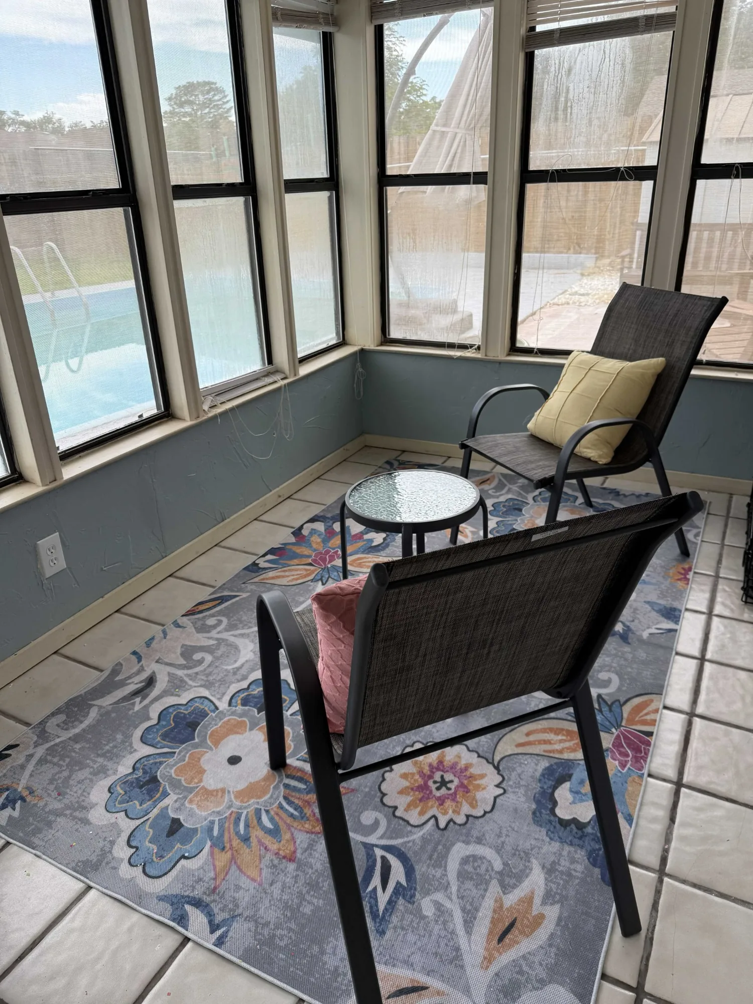 Screened porch with chairs